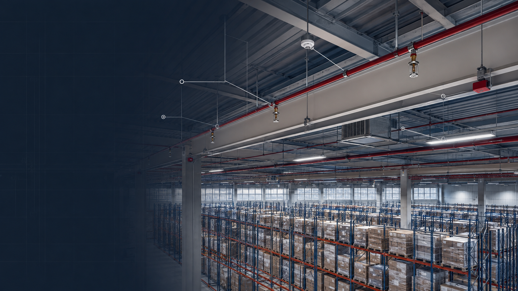 Warehouse high-bay ceiling with sprinkler piping, detectors and racking below